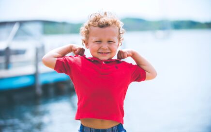 boy standing near dock