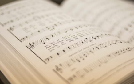 shallow focus photography of musical note book