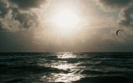 ocean waves under white sky during daytime