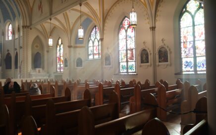 brown wooden chairs inside church