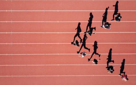 group of people running on stadium