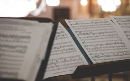 closeup photo of printer paper with musical notes