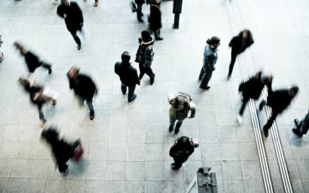 people walking on grey concrete floor during daytime