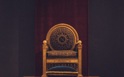 gray and black wooden chair with fabric cushion