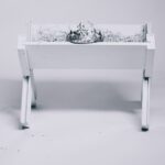 grayscale photography of tiara on table