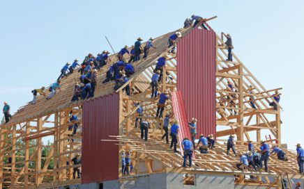 people building structure during daytime