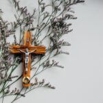 crucifix on wall with flowers
