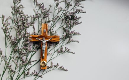 crucifix on wall with flowers