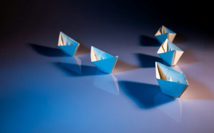 white paper boats on white surface