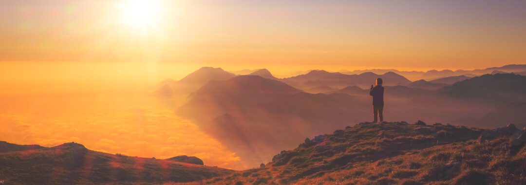 person standing on mountain